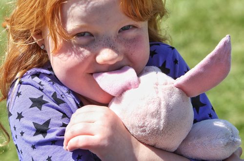 Danica Doig, 5, with her stuffy Piglet at the Teddy Bears' Picnic at Assiniboine Park. The event brings around 30,000 people to the park, mostly kids with their stuffed toys that are damaged and need fixing. The money raised goes towards the Childrens Hospital Foundation of Manitoba.  150531 May 31, 2015 Mike Deal / Winnipeg Free Press