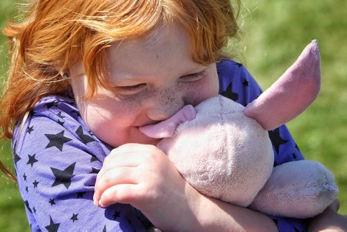 Danica Doig, 5, with her stuffy Piglet at the Teddy Bears' Picnic at Assiniboine Park. The event brings around 30,000 people to the park, mostly kids with their stuffed toys that are damaged and need fixing. The money raised goes towards the Childrens Hospital Foundation of Manitoba.  150531 May 31, 2015 Mike Deal / Winnipeg Free Press