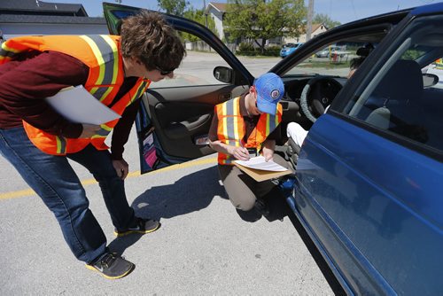 May 31, 2015 - 150531  -  Mitchell Jeffrey and Jeff Boniface, occupational therapists and CarFit technicians, instruct a driver on safety while driving her car Sunday, May 31, 2015 at CAA Manitoba's St. Annes location. CAA Manitoba and the Canadian Association of Occupational Therapists (CAOT) have teamed up to host the first-ever CarFit event, aiming to keep maturing drivers behind the wheel, while keeping safety in mind. John Woods / Winnipeg Free Press
