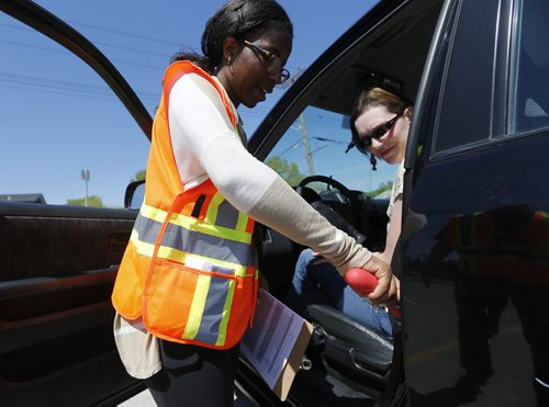 May 31, 2015 - 150531  -  Jane Nzeribe, occupational therapist and CarFit technicians, instruct Julia Couture on safety while driving her car Sunday, May 31, 2015 at CAA Manitoba's St. Annes location. CAA Manitoba and the Canadian Association of Occupational Therapists (CAOT) have teamed up to host the first-ever CarFit event, aiming to keep maturing drivers behind the wheel, while keeping safety in mind. John Woods / Winnipeg Free Press