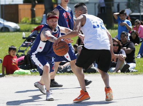 May 31, 2015 - 150531  -  Neechi Commons All-Stars and the Winnipeg Police Service play in a fundraising game for a new north end basketball facility at Ralph Brown Community Centre Sunday, May 31, 2015. John Woods / Winnipeg Free Press