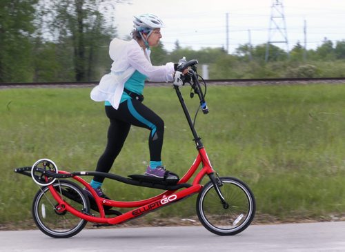 On the Move- A cyclist whips by on Taylor Ave in Winnipeg riding a unique machine crossed between an elliptical exercise machine and a traditional bicycle-Standup Photo- June 01, 2015   (JOE BRYKSA / WINNIPEG FREE PRESS)