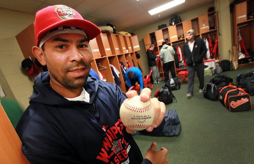 Goldeyes catcher Luis Alen shows off the ball he hit to break the club's  Career Hit record during the team's last road trip. Alen and the team returned this afternoon. See Melissa Martin's Story June 1, 2015 - (Phil Hossack / Winnipeg Free Press)