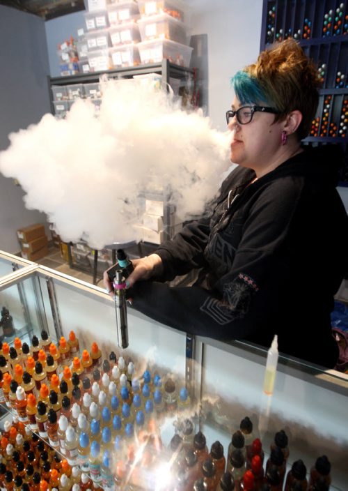 VAPING- Cold Turkey on Edmonton. Cierra Madison works there as a vape specialist and shows how the vaping thing works. BORIS MINKEVICH/WINNIPEG FREE PRESS June 1, 2015