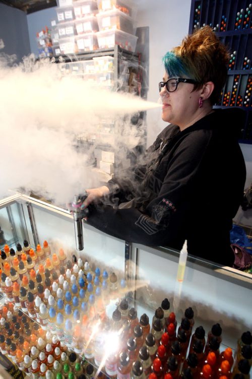 VAPING- Cold Turkey on Edmonton. Cierra Madison works there as a vape specialist and shows how the vaping thing works. BORIS MINKEVICH/WINNIPEG FREE PRESS June 1, 2015
