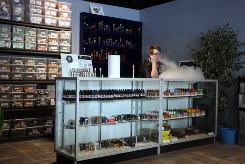 VAPING- Cold Turkey on Edmonton. Cierra Madison works there as a vape specialist and shows how the vaping thing works. BORIS MINKEVICH/WINNIPEG FREE PRESS June 1, 2015