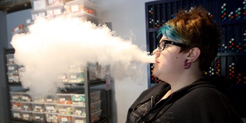 VAPING- Cold Turkey on Edmonton. Cierra Madison works there as a cape specialist and shows how the gaping thing works. BORIS MINKEVICH/WINNIPEG FREE PRESS June 1, 2015