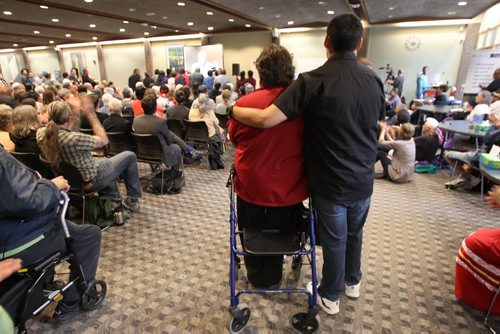 A survivor of residential schools in Canada stands from her walker after being acknowledged by the crowd during a gathering watching the live release of The Truth and Reconciliation Commission report in Ottawa at the University of Winnipeg this morning -See Mary Agnes Welch story- June 02, 2015   (JOE BRYKSA / WINNIPEG FREE PRESS)
Caroline Ouskun with nephew Travis Spence. 
Mackay residential school in dauphin for 7 years starting in 1959.


