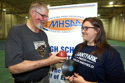 THE 2015 MILK PROVINCIAL HIGH SCHOOL TRACK & FIELD CHAMPIONSHIP. Meet is this weekend. Preview press conference. Max Bell Centre.  (left) Coach Bruce Pirnie with star athlete (right) Taylor Heald. Shot put, discus, javelin. BORIS MINKEVICH/WINNIPEG FREE PRESS June 2, 2015