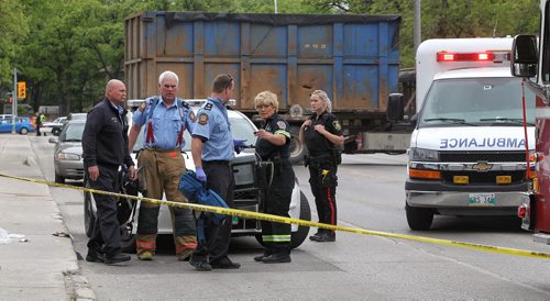 Emergency personnel at the scene of a stabbing outside Kelvin High School early Tuesday afternoon. 150602 June 2, 2015 Mike Deal / Winnipeg Free Press