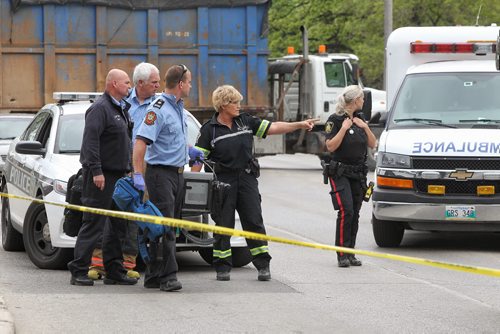 Emergency personnel at the scene of a stabbing outside Kelvin High School early Tuesday afternoon. 150602 June 2, 2015 Mike Deal / Winnipeg Free Press