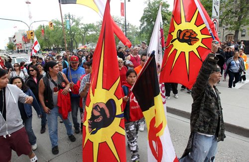 Hundreds march down Portage Ave in downtown Winnipeg to mark the release of The Truth and Reconciliation Commission report in Ottawa -See Mary Agnes Welch story- June 02, 2015   (JOE BRYKSA / WINNIPEG FREE PRESS)