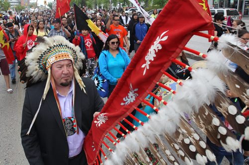 Assembly of Manitoba Chiefs Grand Chief Derek Nepinak leads a large group walks down Portage Ave in downtown Winnipeg to mark the release of The Truth and Reconciliation Commission report in Ottawa -See Mary Agnes Welch story- June 02, 2015   (JOE BRYKSA / WINNIPEG FREE PRESS)