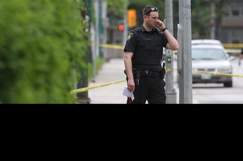 Police at the scene of a stabbing outside Kelvin High School early Tuesday afternoon. 150602 June 2, 2015 Mike Deal / Winnipeg Free Press