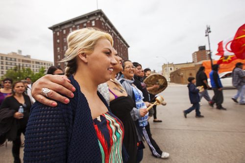 Anna Gentes (left) and Tricia Seymour march on the Walk for Reconciliation on Tuesday, June 2, 2015.  The march went through downtown from the University of Winnipeg, and finished at the Thunderbird House for a feast and pipe ceremony. Mikaela MacKenzie / Winnipeg Free Press