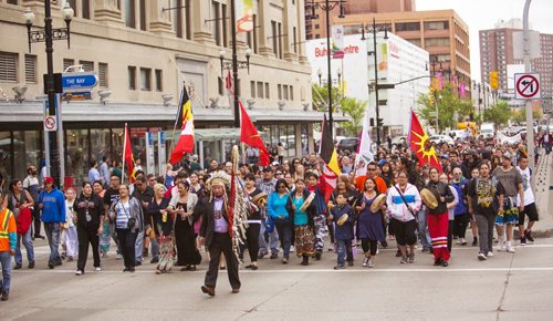 Assembly of Manitoba Chiefs Grand Chief Derek Nepinak leads survivors, descendants, and supporters in the Walk for Reconciliation on Tuesday, June 2, 2015.  The march went through downtown from the University of Winnipeg, and finished at the Thunderbird House for a feast and pipe ceremony. Mikaela MacKenzie / Winnipeg Free Press