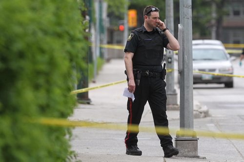 Police at the scene of a stabbing outside Kelvin High School early Tuesday afternoon. 150602 June 2, 2015 Mike Deal / Winnipeg Free Press