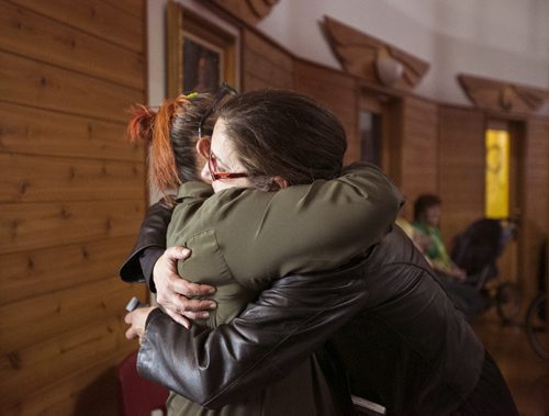 Lorraine Clemens hugs a friend, Rebecca Murdock, at the Thunderbird House after  the Walk for Reconciliation on Tuesday, June 2, 2015.  The march went through downtown from the University of Winnipeg, and finished at the Thunderbird House for a feast and pipe ceremony. Mikaela MacKenzie / Winnipeg Free Press