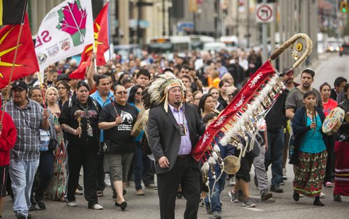 Assembly of Manitoba Chiefs Grand Chief Derek Nepinak leads survivors, descendants, and supporters in the Walk for Reconciliation on Tuesday, June 2, 2015.  The march went through downtown from the University of Winnipeg, and finished at the Thunderbird House for a feast and pipe ceremony. Mikaela MacKenzie / Winnipeg Free Press
