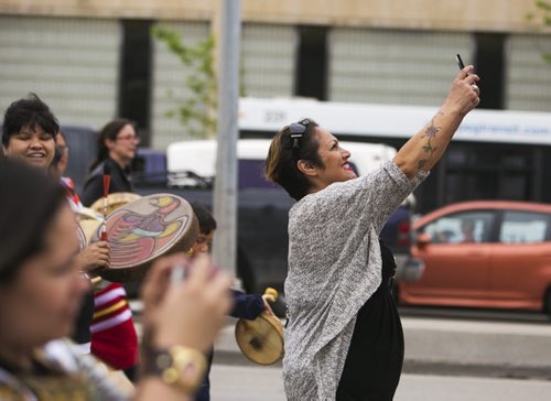 Tricia Seymour takes a selfie on the Walk for Reconciliation on Tuesday, June 2, 2015.  The march went through downtown from the University of Winnipeg, and finished at the Thunderbird House for a feast and pipe ceremony. Mikaela MacKenzie / Winnipeg Free Press