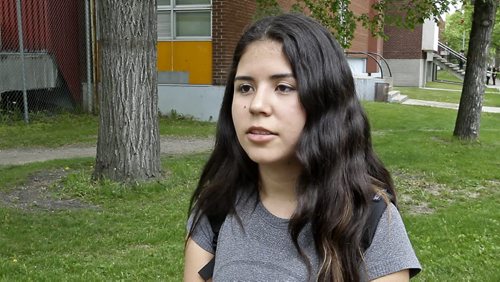 Sophia Vodniza a grade 9 student at Kelvin High School reacts to the stabbing that occurred over the lunch hour. 150602 - Tuesday, June 02, 2015 -  MIKE DEAL / WINNIPEG FREE PRESS