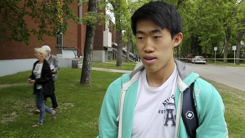 Michael Byun a grade 12 student at Kelvin High School reacts to the stabbing that occurred over the lunch hour. 150602 - Tuesday, June 02, 2015 -  MIKE DEAL / WINNIPEG FREE PRESS