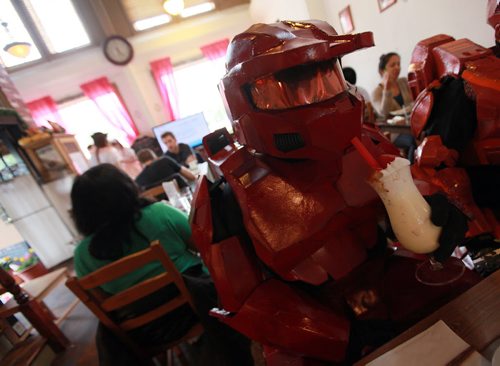 Mark Laubmann dressed as (Sarge) works his soda through a helmet at Dwarf & Cachette, a Japanese restaurant that incorporates cos-play, anime etc. into its menu.  See Dave Sanderson's story. On Tuesday, the restaurant is hosting a special event - the first of its kind - when waitresses will dress in Japanese  maid's garb, to personally serve customers (i still don't know what this all means - I'm going there at noon to get the gist of it all...) Apparently this is a big thing in Japan and Dwarf & Cachette is the first Japanese restaurant in Winnipeg to incorporate  this type of service... June 2, 2015  - (Phil Hossack / Winnipeg Free Press)