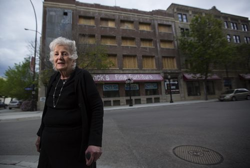 Cynthia Brick stands in front of her store, Brick's Fine Furniture, on Wednesday, June 3, 2015.  The store will be closing after 46 years of being in business, and construction going on above her in the building contributed to the decision to close. Mikaela MacKenzie / Winnipeg Free Press