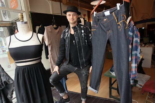 Fashion designer Lennard Taylor in his new temporary storefront location at  223 McDermot Ave with some of his clothing creations. He became of the seven local retailers who participated in last years Launch It! Retail Incubator program. Hes the only that ended up opening a store in the downtown after participating in the three-week pilot project.-See Murray McNeil story- June 03, 2015   (JOE BRYKSA / WINNIPEG FREE PRESS)