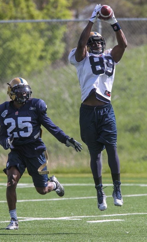 Clarence Denmark (89) makes a catch during day 4 of the Winnipeg Blue Bomber training camp Wednesday morning. 150603 - Wednesday, June 03, 2015 -  MIKE DEAL / WINNIPEG FREE PRESS