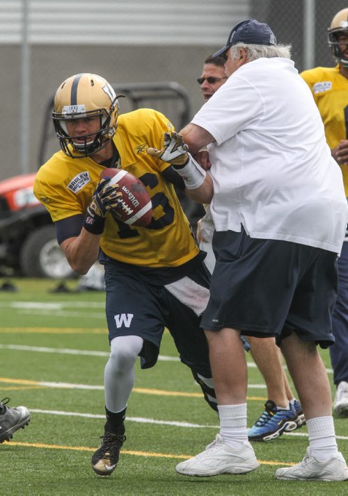 Quarterback Robert Marve (16) takes too many steps backward into coach Bob Wylie during day 4 of the Winnipeg Blue Bomber training camp Wednesday morning. 150603 - Wednesday, June 03, 2015 -  MIKE DEAL / WINNIPEG FREE PRESS