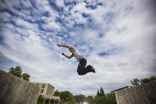 Marc Selby does parkour at the University of Manitoba  campus on Wednesday, June 3, 2015.  "It's like going out and playing," says Selby. Mikaela MacKenzie / Winnipeg Free Press