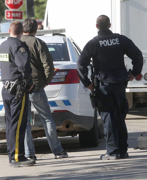 RCMP have converged on a home in the 100 block of Carletta Cres in Charleswood  Thursday morning- About 15-20 officers including a identification unit , canine unit are searching the residence-  Breaking News- June 04, 2015   (JOE BRYKSA / WINNIPEG FREE PRESS)