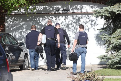 RCMP have converged on a home in the 100 block of Carletta Cres in Charleswood  Thursday morning- About 15-20 officers including a identification unit , canine unit are searching the residence-  Breaking News- June 04, 2015   (JOE BRYKSA / WINNIPEG FREE PRESS)