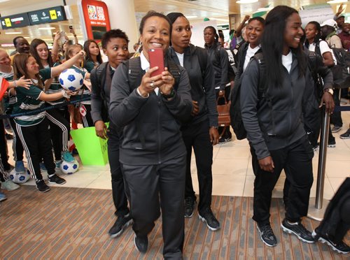 Winnipeg soccer fans welcome team Nigeria ( in black) to the James A Richardson International airport Thursday for the 2015 FIFA Womens World Cup  -  Sports- June 04, 2015   (JOE BRYKSA / WINNIPEG FREE PRESS)