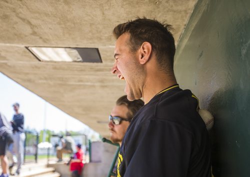 Michael Wing of the Sioux Falls Canaries winces while massaging his back with a baseball in the dugout at Shaw Park on Thursday, June 4, 2015.  Mikaela MacKenzie / Winnipeg Free Press