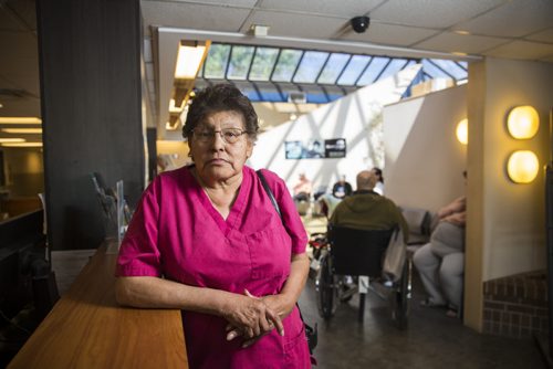 Jessie Howell stands in the lobby of the Mount Carmel Clinic on Thursday, June 4, 2015. Howell lives on a limited budget, and a significant portion of her income goes to medical expenses such as prescriptions and glasses.  She believes that Aboriginals are treated differently by the medical system, and that unhealthy life choices are influenced by many generations of problems.  Mikaela MacKenzie / Winnipeg Free Press