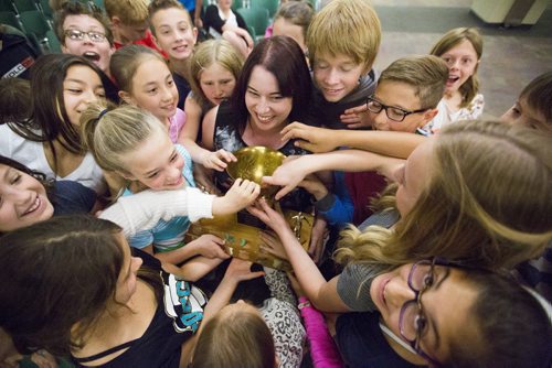 Students from Pacific Junction School crowd around a trophy at the school patrol awards held in the RBC Convention Centre on Friday, June 5, 2015. Mikaela MacKenzie / Winnipeg Free Press