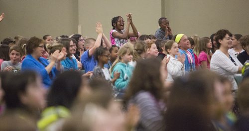 Serena Anakeu-Kake stands up from the crowd to cheer at the school patrol awards held at the RBC Convention Centre on Friday, June 5, 2015. Mikaela MacKenzie / Winnipeg Free Press
