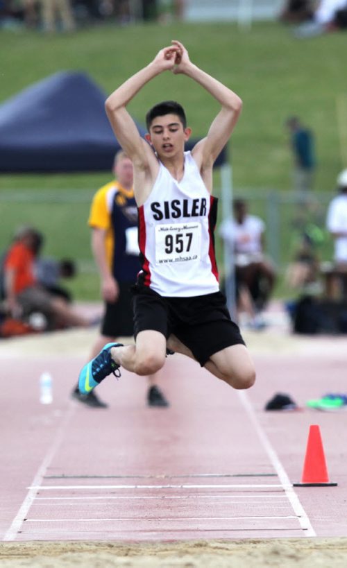 Marcello Aiello sails through the air in the preliminary event of the Jr Varsity triple jump Friday at the MSHAA Provincial Track and Field Championships at University Stadium at the University of Manitoba. June 5, 2015 - (Phil Hossack / Winnipeg Free Press)