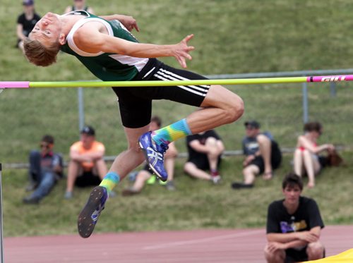 Neelin High School's Brodie Gill sails over the high jump the Jr Varsity triple jump Friday at the MSHAA Provincial Track and Field Championships at University Stadium at the University of Manitoba. Unfortunately his heel brought the bar down in this preliminary jump. June 5, 2015 - (Phil Hossack / Winnipeg Free Press)