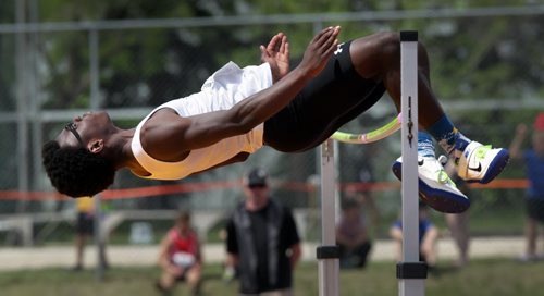 Adeyemi Fatoye sails over the bar in the Jr Varsity men's high jump Friday at the MSHAA Provincial Track and Field Championships at University Stadium at the University of Manitoba. June 5, 2015 - (Phil Hossack / Winnipeg Free Press)