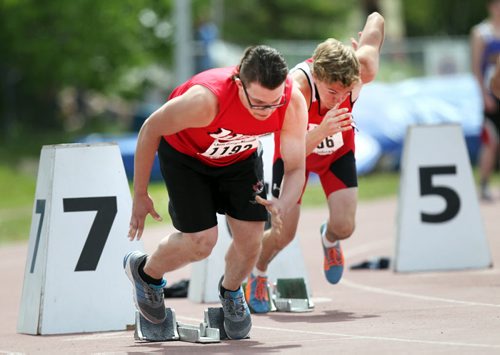 Mike Swain of O of W Collegiate, (left) and Jack Kennedy of R.D. Parker Collegiate fly off the blocks in the Jr Varsity 200 meter dash Friday at the MSHAA Provincial Track and Field Championships at University Stadium at the University of Manitoba. June 5, 2015 - (Phil Hossack / Winnipeg Free Press)