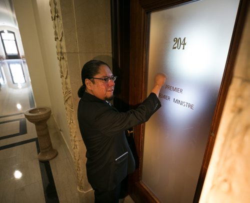 Maeengan Linklater knockson the door of the Premier's office to deliver his Manitoba Indian Residential School Genocide and Reconciliation Memorial Day Act at the Manitoba Legislature Friday afternoon. June 05, 2015 - MELISSA TAIT / WINNIPEG FREE PRESS