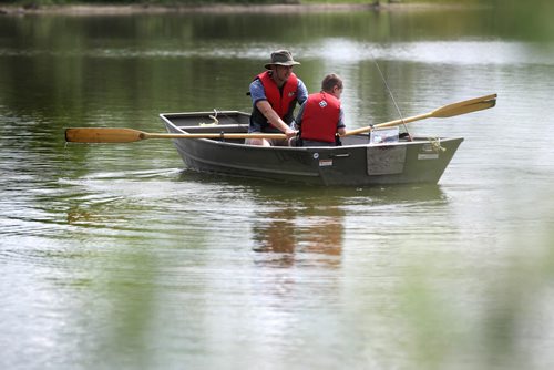 Colin Flemington and his son James decide to start off the weekend early by going fishing together at Fort Whyte Friday afternoon.  James, who is home schooled,  finished his work early allowing time away with dad to enjoy the warm weather.   Standup photo   June 05, 2015 Ruth Bonneville / Winnipeg Free Press
