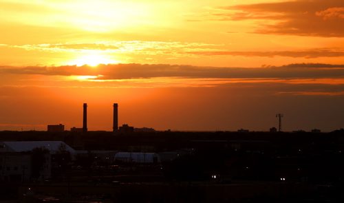 Sun rises over Winnipeg, seen from Westview Park, aka Garbage Hill, Saturday, June 6, 2015. (TREVOR HAGAN/WINNIPEG FREE PRESS)