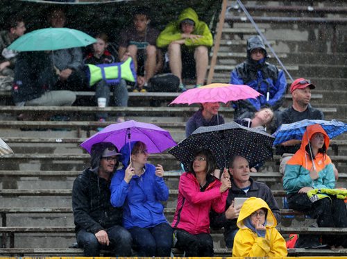 Spectators during MSHAA Provincial Track and Field Championships during heavy rain, at University Stadium at the University of Manitoba, Saturday, June 6, 2015. (TREVOR HAGAN/WINNIPEG FREE PRESS)