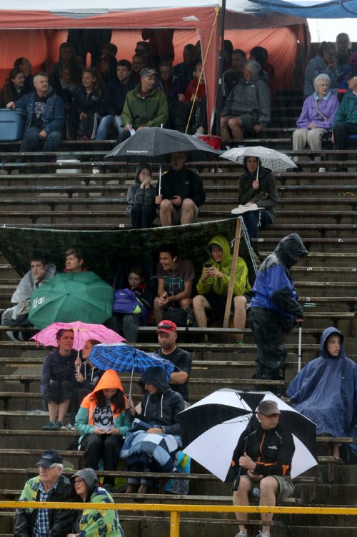 Spectators during MSHAA Provincial Track and Field Championships during heavy rain, at University Stadium at the University of Manitoba, Saturday, June 6, 2015. (TREVOR HAGAN/WINNIPEG FREE PRESS)