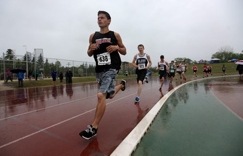 MSHAA Provincial Track and Field Championships during heavy rain, at University Stadium at the University of Manitoba, Saturday, June 6, 2015. (TREVOR HAGAN/WINNIPEG FREE PRESS)