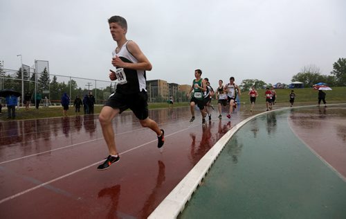 MSHAA Provincial Track and Field Championships during heavy rain, at University Stadium at the University of Manitoba, Saturday, June 6, 2015. (TREVOR HAGAN/WINNIPEG FREE PRESS)